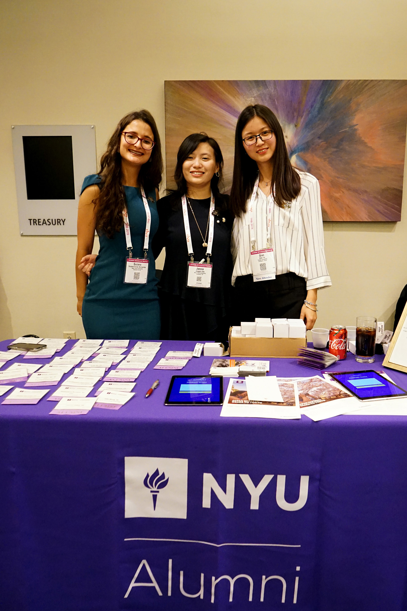 Students Suzana Duran-Bernardes, Jingqin Gao and Qian Ye pose for a picture outside the NYU/C2SMART reception at TRB.