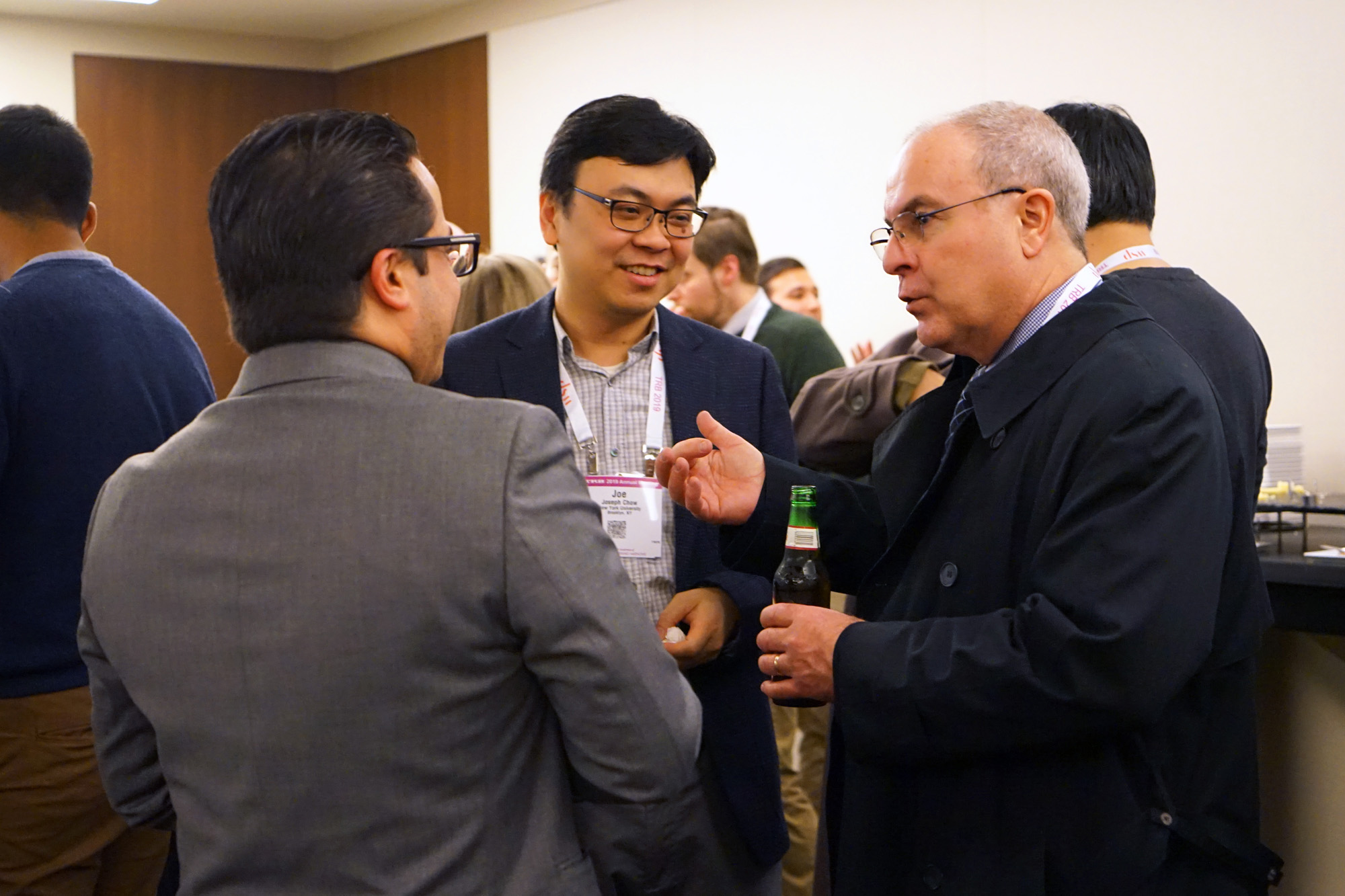 Professor Joseph Chow talks with guests at the NYU/C2SMART reception at TRB