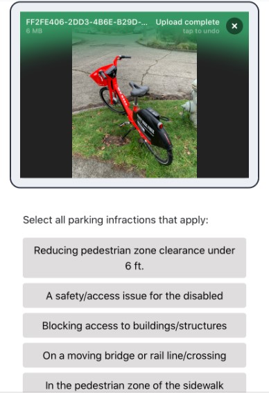 Photogaph of an app showing a bicycle and a selection of infractions to choose from